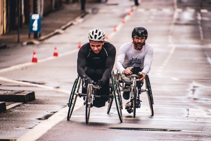 Two Wheelchair Racers competing in a wheelchair race