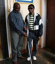 Man who is Blind learning Mobility and Orientation Techniques